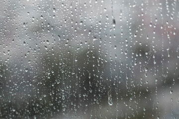 raindrops on window in monochrome