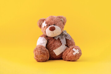concept of pain and illness problem, teddy bear toy wrapped in bandage, accident injury