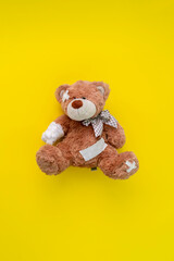concept of pain and illness problem, teddy bear toy wrapped in bandage, accident injury