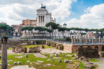 View of ancient roman ruins and historical palace built by Mussolini in Rome