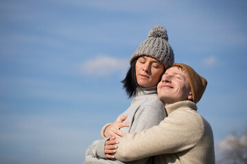 Happy couple face to face and Valentine's Day. Couple in love. Sky background. Sensual. Smile. 