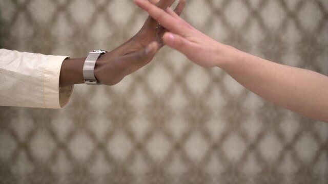 Happy bridal couple touching hands