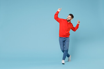 Full length young caucasian happy bearded overjoyed relaxed excited man 20s in casual red orange...