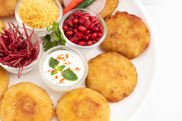 Decorated Plate Of Indian Chaat Snacks Aloo Tikki Also Known As Alu Ki Tikkia Is Seasoned Boiled Mashed Potato Cutlet Or Patties Served With Dahi Chat Masala Anar Sev Bhujia Chopped Chukandar