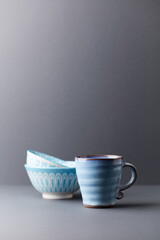 Traditional, handcrafted ceramic on gray background. Soft focus. Copy space.