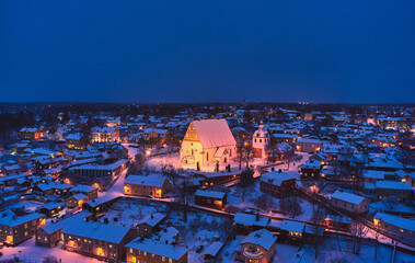 Obraz premium Aerial view of Old Porvoo in the winter evening with Christmas decoration, Finland. Porvoo is one of the most famous, beautiful old Finnish cities.