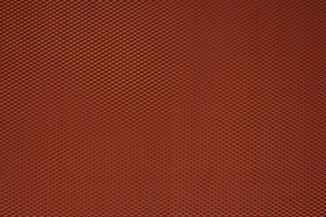 Abstract closeup of metallic background with orange background