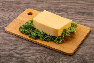 Tasty yelloow Tilsiter cheese brick