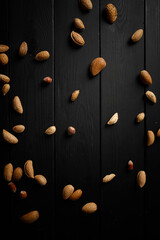 nuts on the wooden black background
