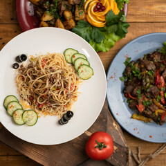 Spaghetti or pasta, Simple rustic food. Hearty lunch. Serving plate of Italian traditional food. Top view. Square format 1x1. Template for restaurant menu design and social media web publications.