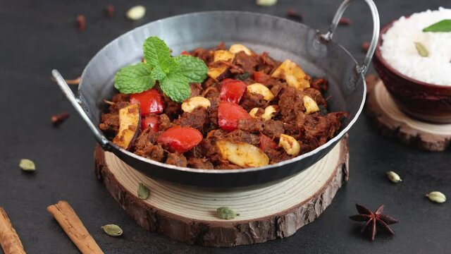  Mutton roast curry , Chukhandar gosht spicy delicious traditional homemade meat beef roast curry 4K slow motion video footage Kerala India Sri Lanka Pakistan made Indian spices coconut pieces cashew 