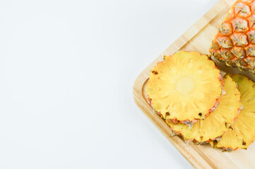 Fresh pineapple slices over white background. Tropical fruit.