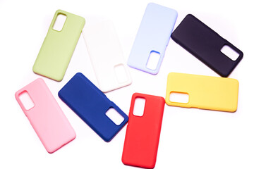 Colorful plastic back covers for mobile phones on white background. mobile phone protection. copy space