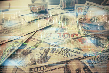 Multi exposure of forex chart drawing over us dollars bill background. Concept of financial success markets.