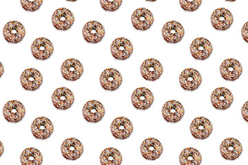 Pattern with dark chocolate donuts and colorful sprinkles with white background