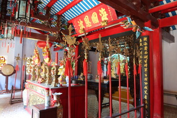Hoi An, Vietnam, March 8, 2021: Colorful decoration in the main hall of a Taoist Temple in Hoi An, Vietnam