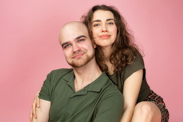 White young man and woman isolated on pink