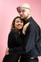 White young man and woman isolated on pink