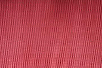 Abstract closeup of metallic background with colour background