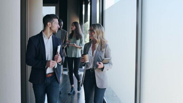 Group of entrepreneurs leaving office after successful negotiations