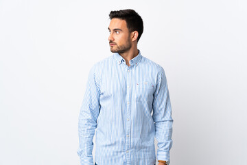 Fototapeta premium Young handsome man over isolated background looking to the side