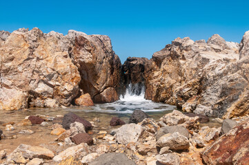 Fototapeta na wymiar Landscape of beautiful bay with rocky beach in Kos island, Greece