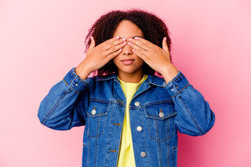 Young african american mixed race woman isolated afraid covering eyes with hands.