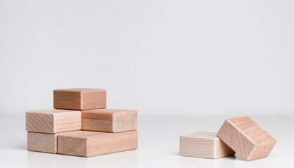 shot of wooden cube on the grey background with copy space