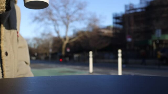 Person drinking a coffee outside