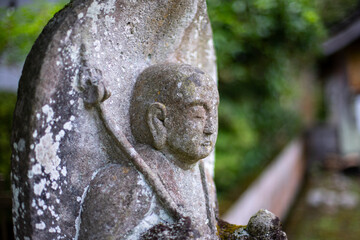 Closeup Unknown Japanese Jiro Statue in the woods.