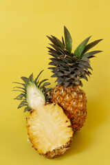 Pineapple isolated on yellow background