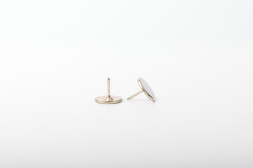 Iron pushpin on a white background