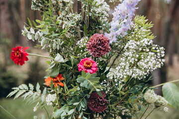 Wedding decorations. Floristics. Composition of flowers and greenery in the area of the wedding ceremony