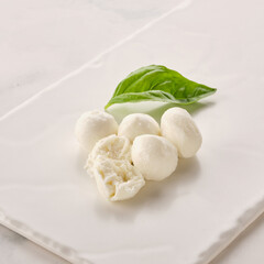 Bowl of small mozzarella balls.