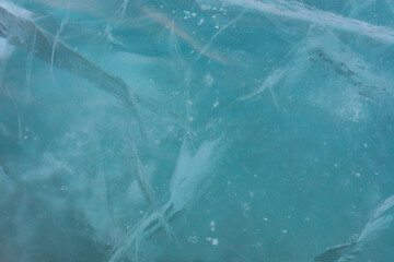 Fototapeta premium Turquoise ice of frozen river, background