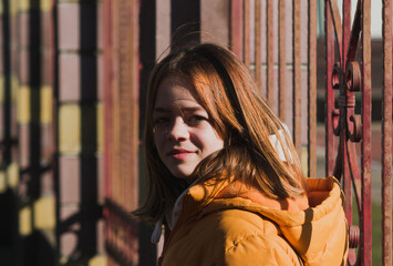 Portrait image of a young girl in the spring sun
