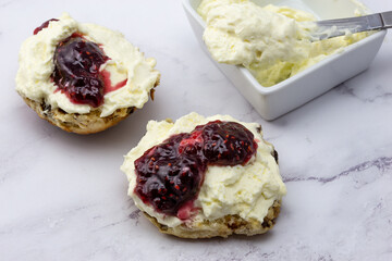 Fruit scone with strawberry jam and cream