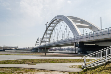 Novi Sad, Serbia - March 08. 2021: Zezelj bridge on river Danube in Novi Sad Serbia. The prospect of built New Zezelj Bridge viewed from the Petrovaradin side of the promenade.