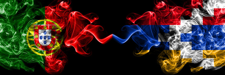 Portugal, Portuguese vs Artsakh, Artsakhtsi, Nagorno Karabakh smoky mystic flags placed side by side. Thick colored silky abstract smoke flags.