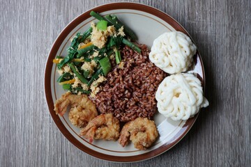 Typical Javanese diet dishes, vegetable, fried shrimp, and Javanese crackers