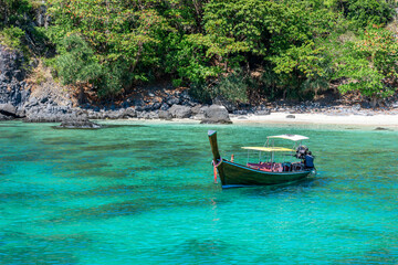 Fototapeta na wymiar boat in the turquoise sea off Racha island in Thailand