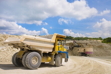 A large quarry dump truck loaded with rock.