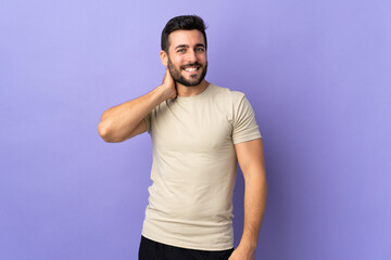 Fototapeta premium Young handsome man with beard over isolated background laughing