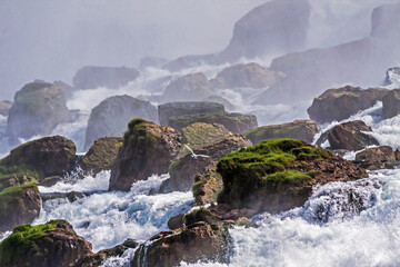 dramatic and spectacular image of the Niagara Falls taken during summer.