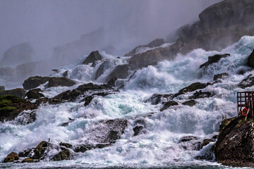 dramatic and spectacular image of the Niagara Falls taken during summer.