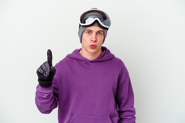 Young man holding a snowboard board isolated on white background having some great idea, concept of creativity.