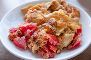 close up of omelet fried with tomato