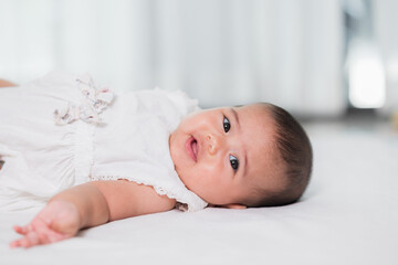 Asian baby cute in the living room at home with family.