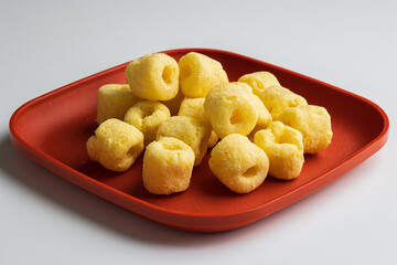 Crispy Corn rings salty snacks. Fast food or junk food snacks unhealthy concept.