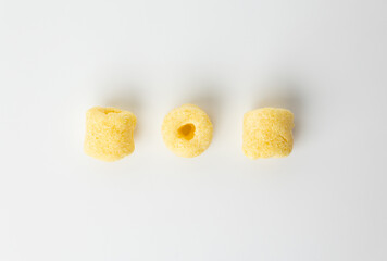 Crispy Corn rings salty snacks. Fast food or junk food snacks unhealthy concept.